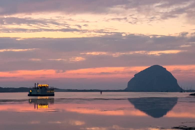 View of Morro Rock with boat passing