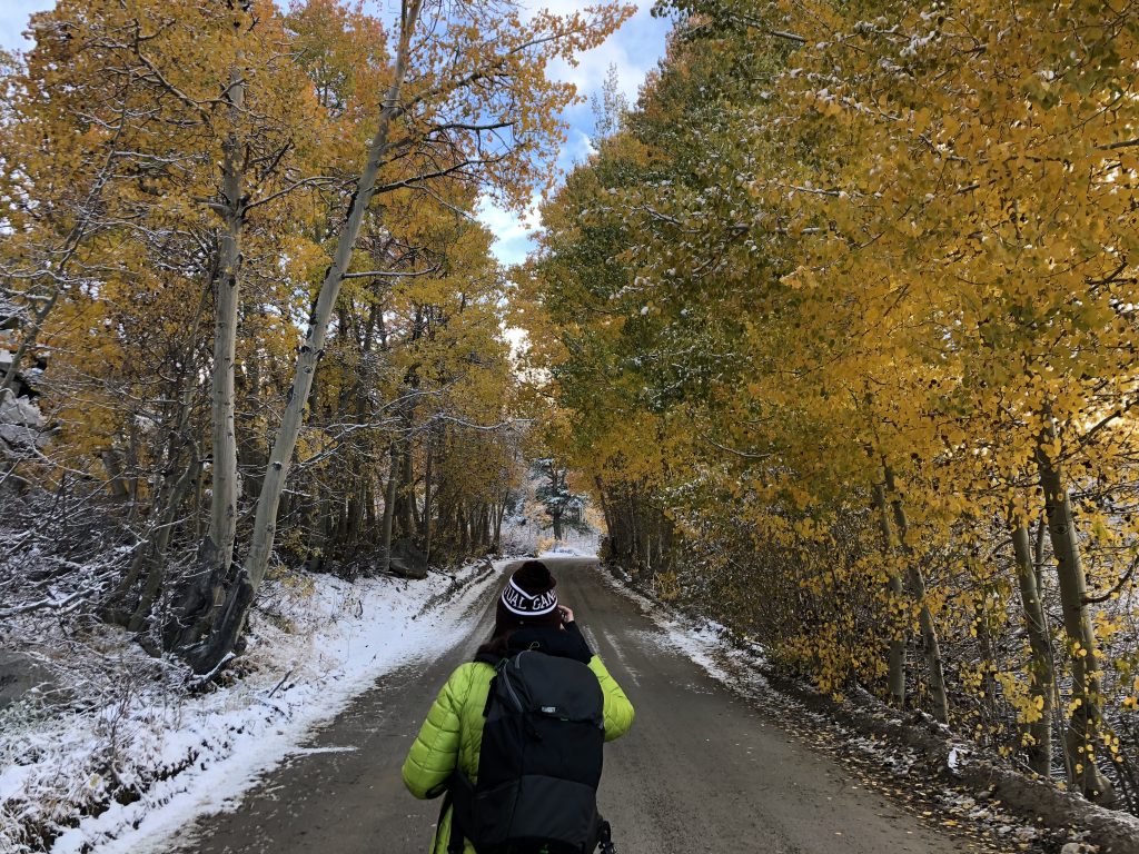 Showing Basak Prince shooting in Eastern Sierra wearing the Think Tank Rotation 22L camera backpack