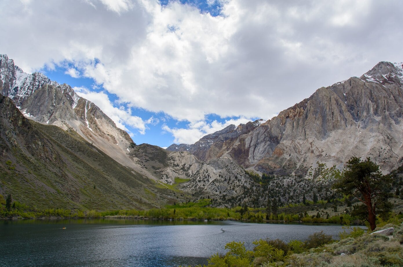 View of a boat sailing at Convict Lake from the trail
