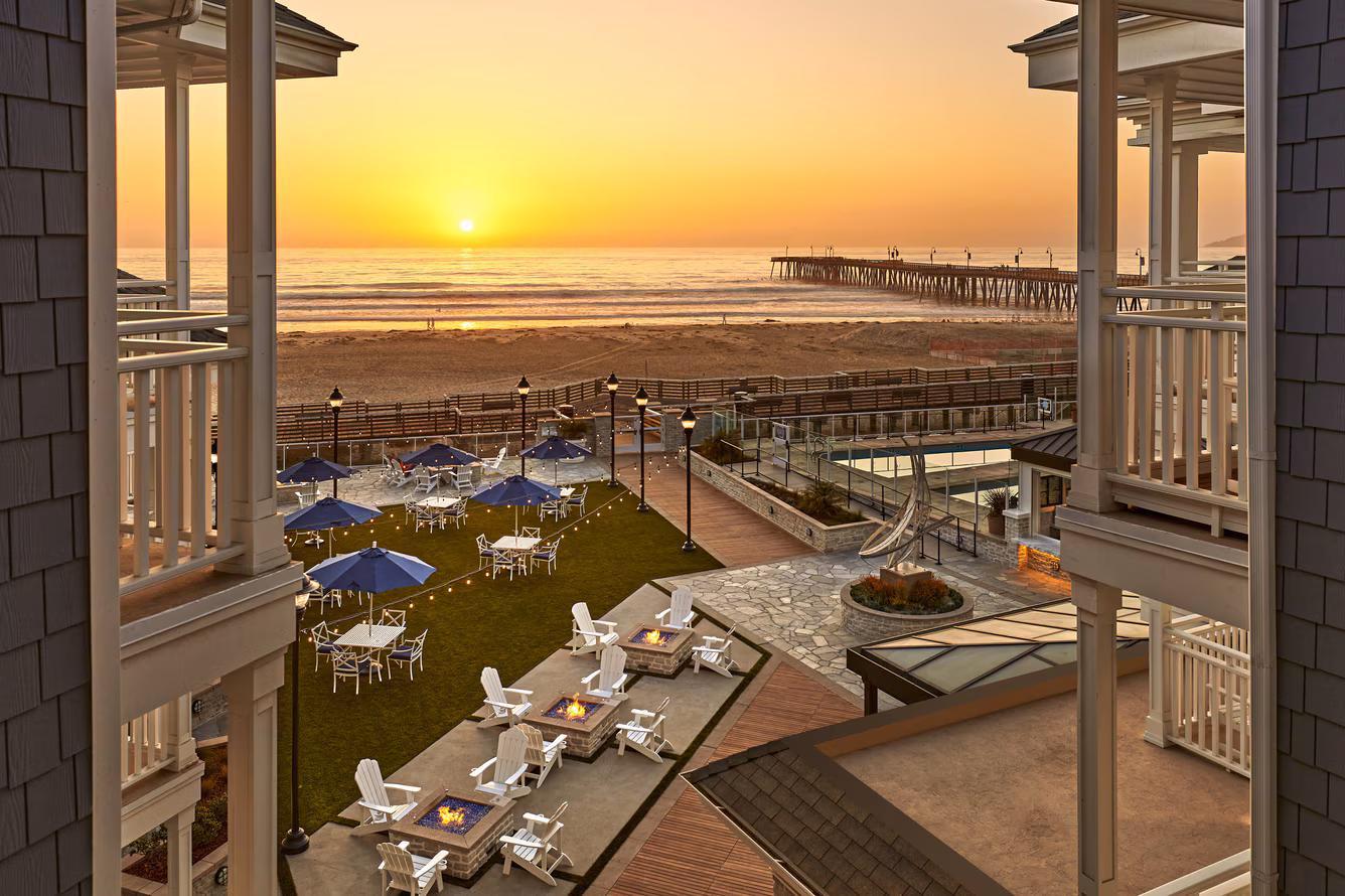 Vespera Resort in Pismo Beach with oceanfront courtyard, fire pits, and sunset view of the Pismo Beach Pier