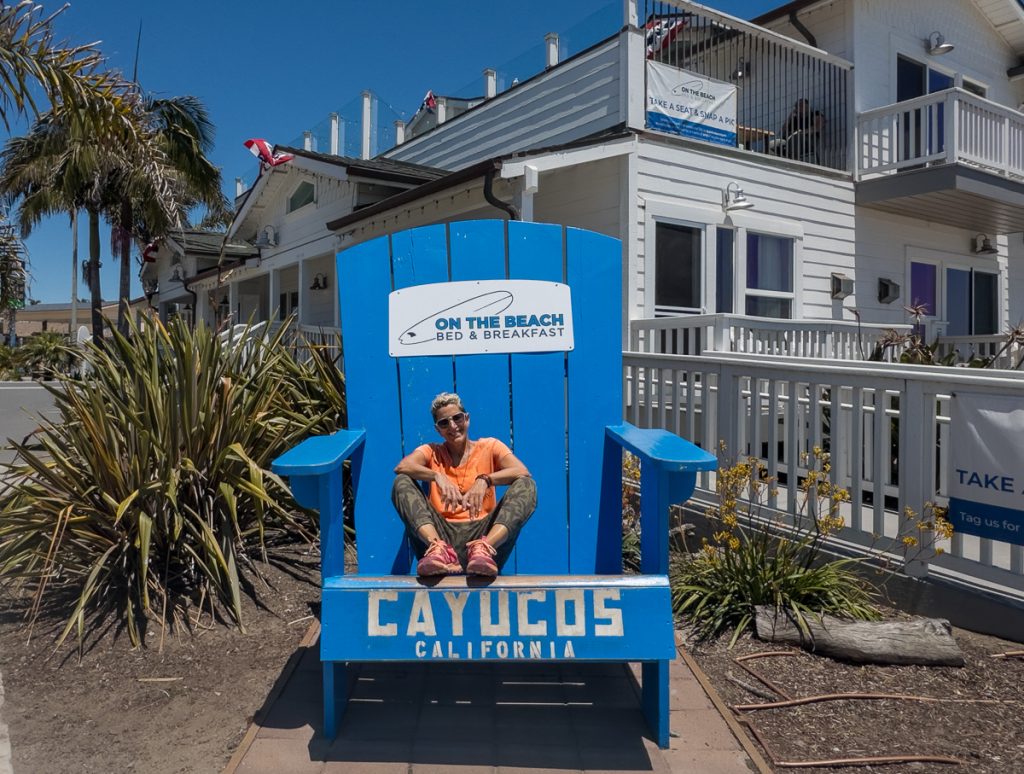 Blue Cayucos California photo sign near the beach and pier in downtown Cayucos.