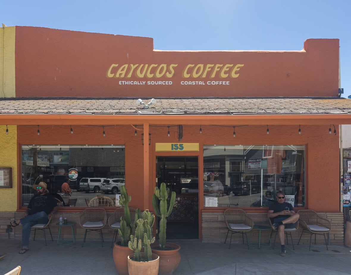 Cayucos Coffee storefront on Ocean Avenue with outdoor seating.