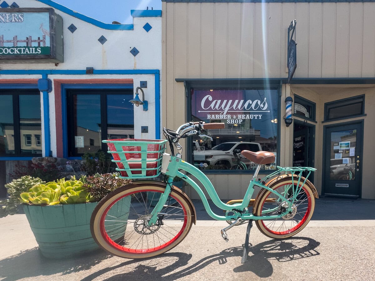 Bicycle parked in front of cafes and shops along Ocean Avenue in Cayucos.