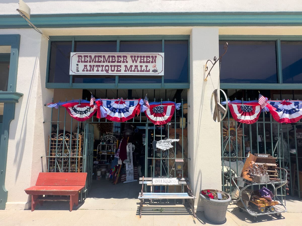 Remember When Antique Mall storefront on Ocean Avenue in Cayucos decorated with patriotic bunting.
