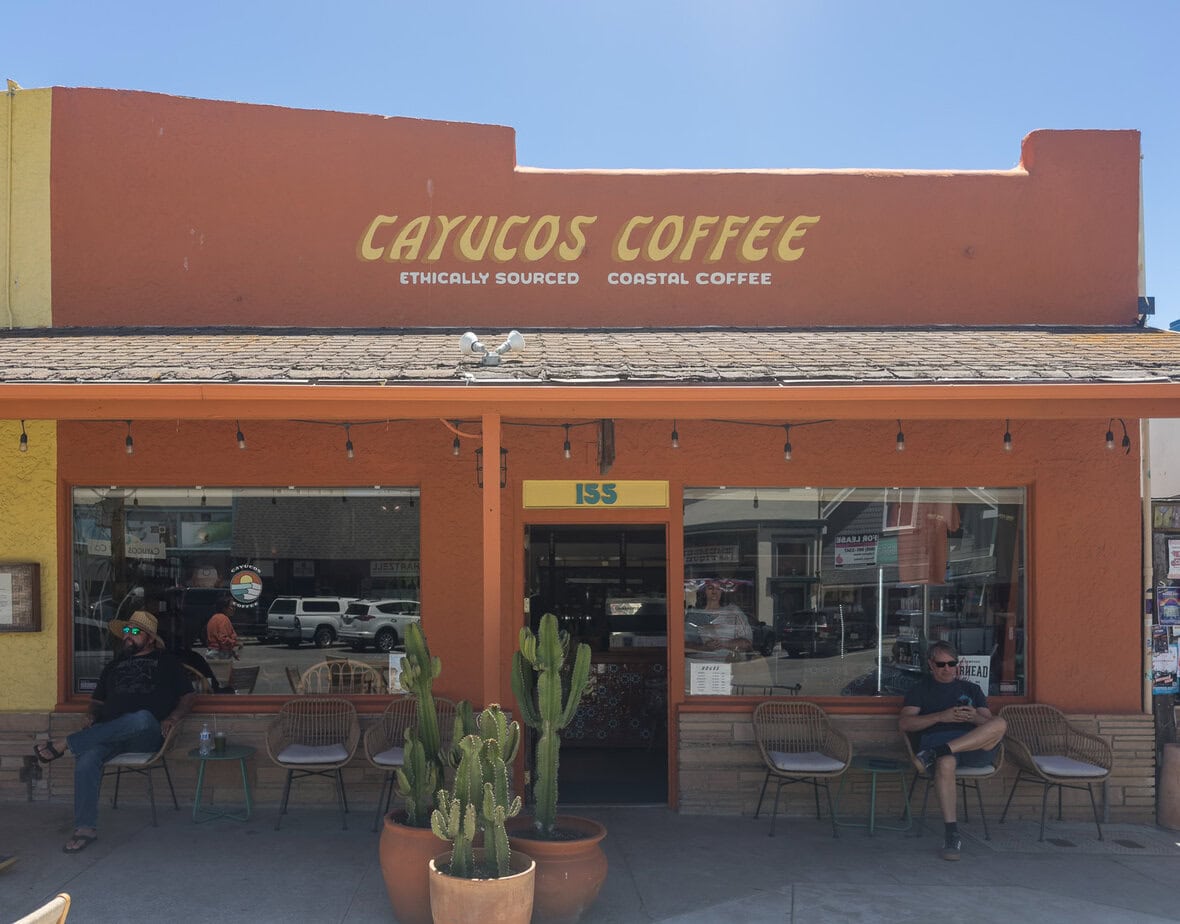 Cayucos Coffee storefront on Ocean Avenue with outdoor seating.